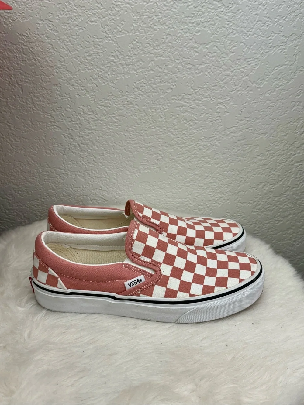 Vans Women’s Checkerboard Slip-On Sneakers in Light Pink (Dusty Pink) and White.
